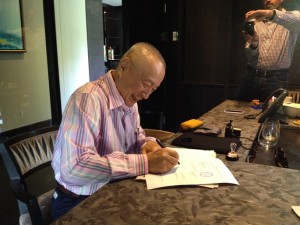 Prof signing a Loan Oprion Agreement